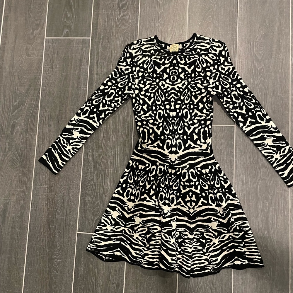 Fit and flare. Has a lot of give. Very generous fit. Comfortable